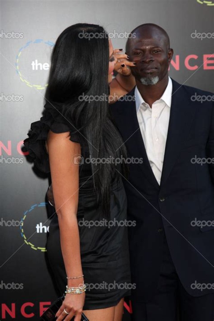 Kimora Lee Simmons and Djimon Hounsou show off their hard beach bodies