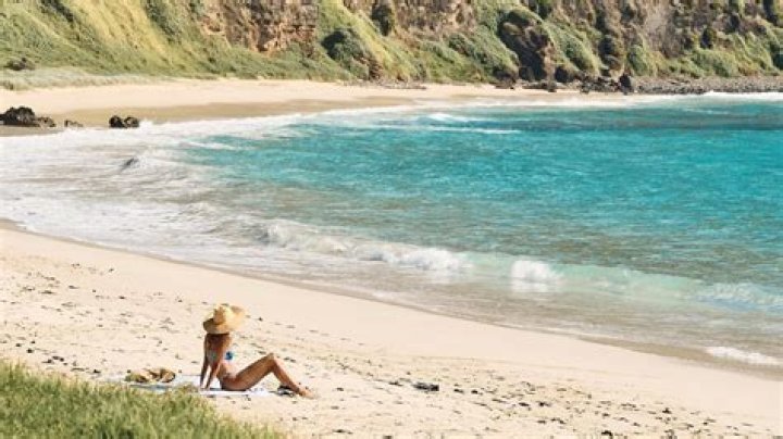 Megan Fox writhing around on secluded beach in bikini has fans 'proposing'